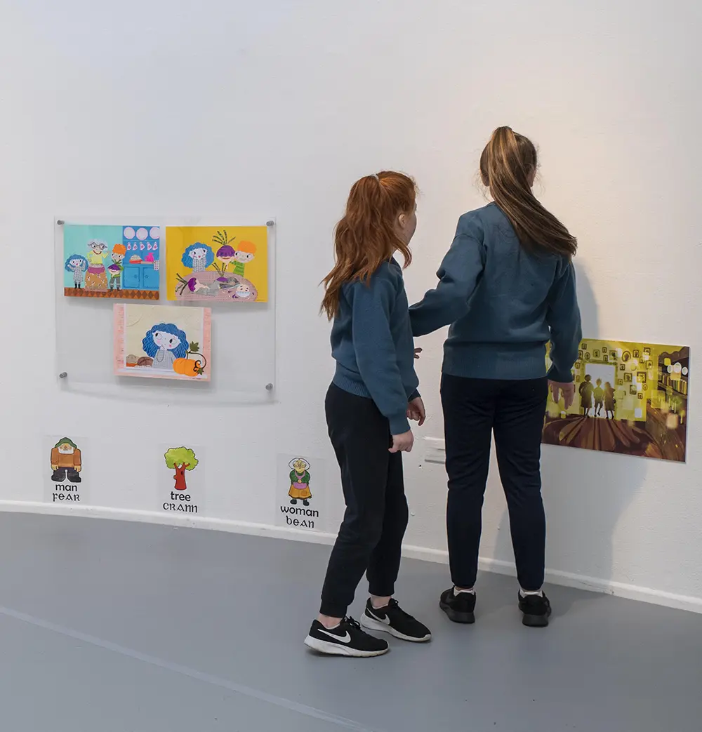 Children from Scoil Eoin looking at the art