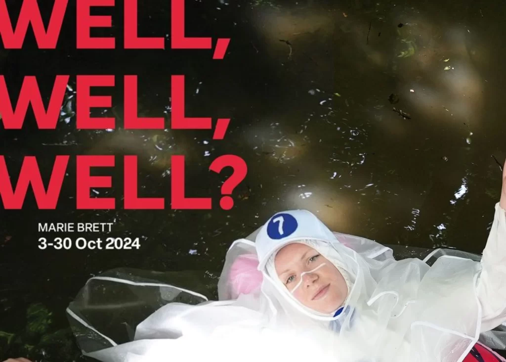 Person in white costume floating, bold red text: "WELL, WELL, WELL?"—Siamsa Tíre theatre Tralee.