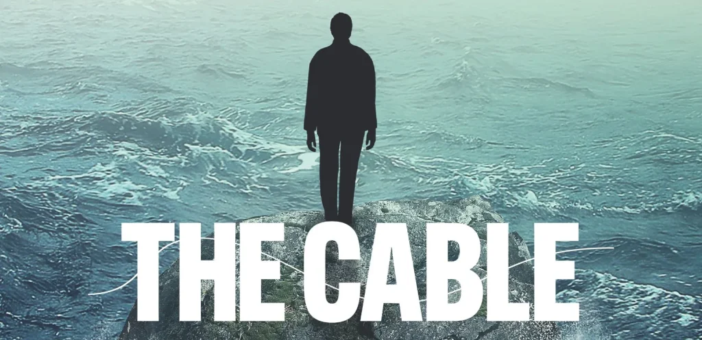 A silhouette on a rock above waves, “THE CABLE” in bold—Siamsa Tíre theatre Tralee.