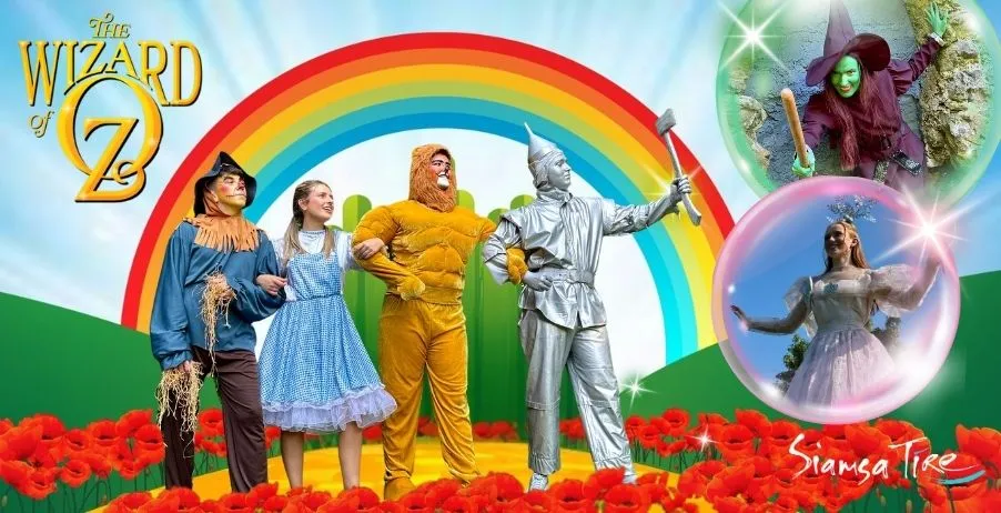 Four Oz characters and magical beings before a rainbow at Siamsa Tíre theatre Tralee.
