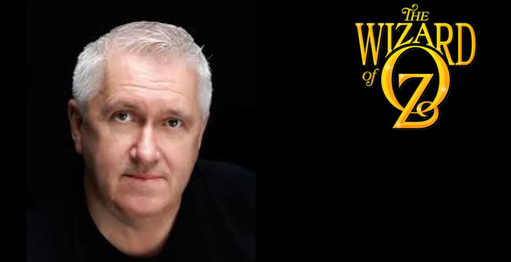 A man with short gray hair beside "The Wizard of Oz" logo at Siamsa Tíre theatre Tralee.