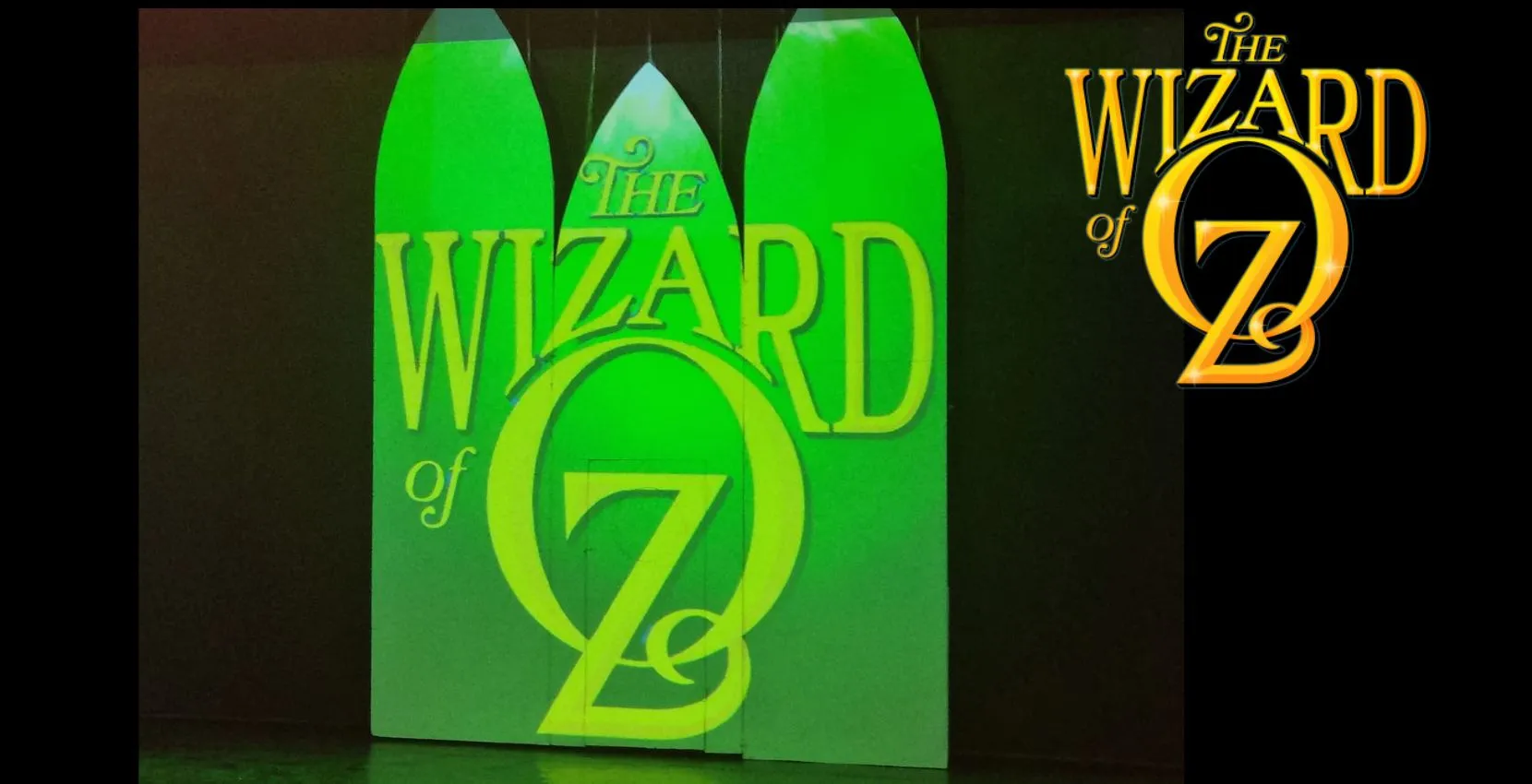 Green stage doors with "The Wizard of Oz" logo at Siamsa Tíre venue hire Tralee.
