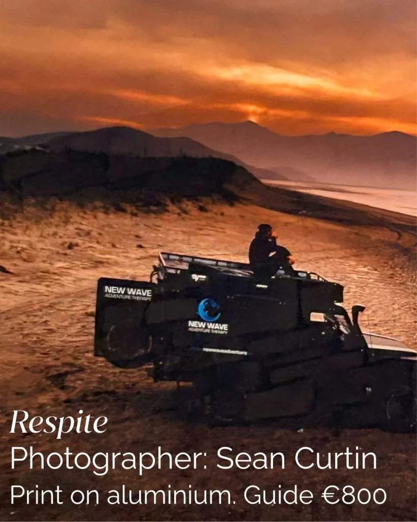 Person sits on a vehicle at sunset, evoking Siamsa Tíre traditional Irish arts performances.