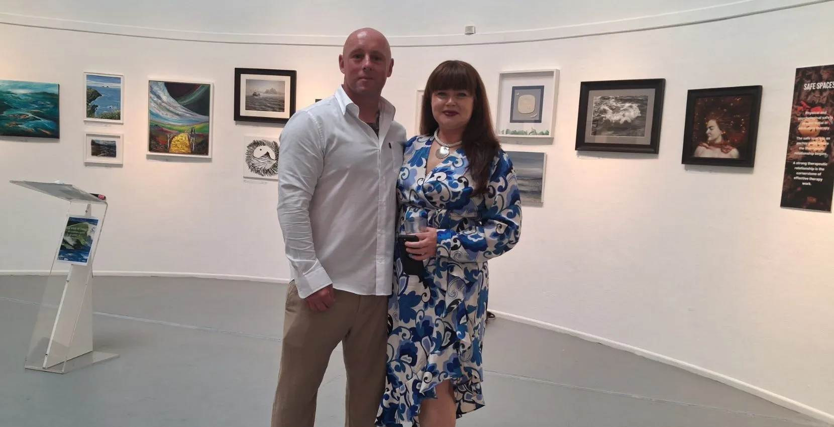 A man and woman pose at Siamsa Tíre, home of traditional Irish arts performances in Tralee.