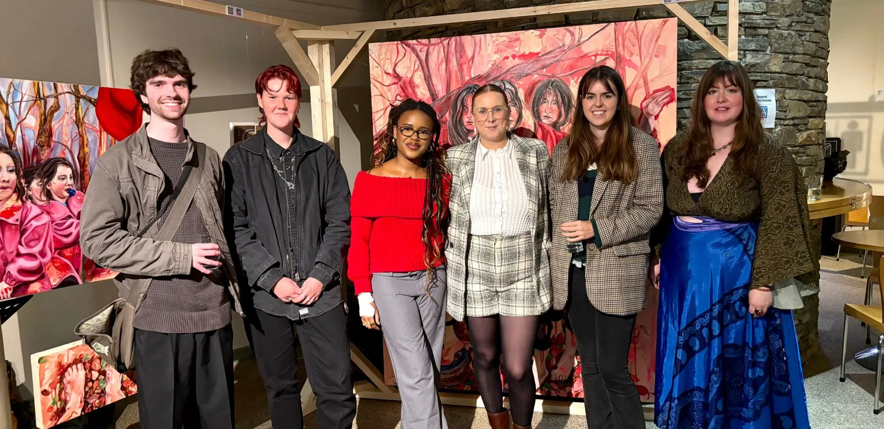 6 young people standing in an art gallery