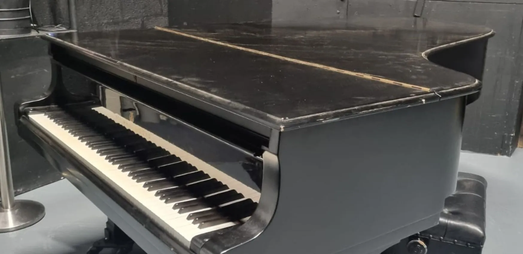 Close up of an old Black Steinway Model C Piano