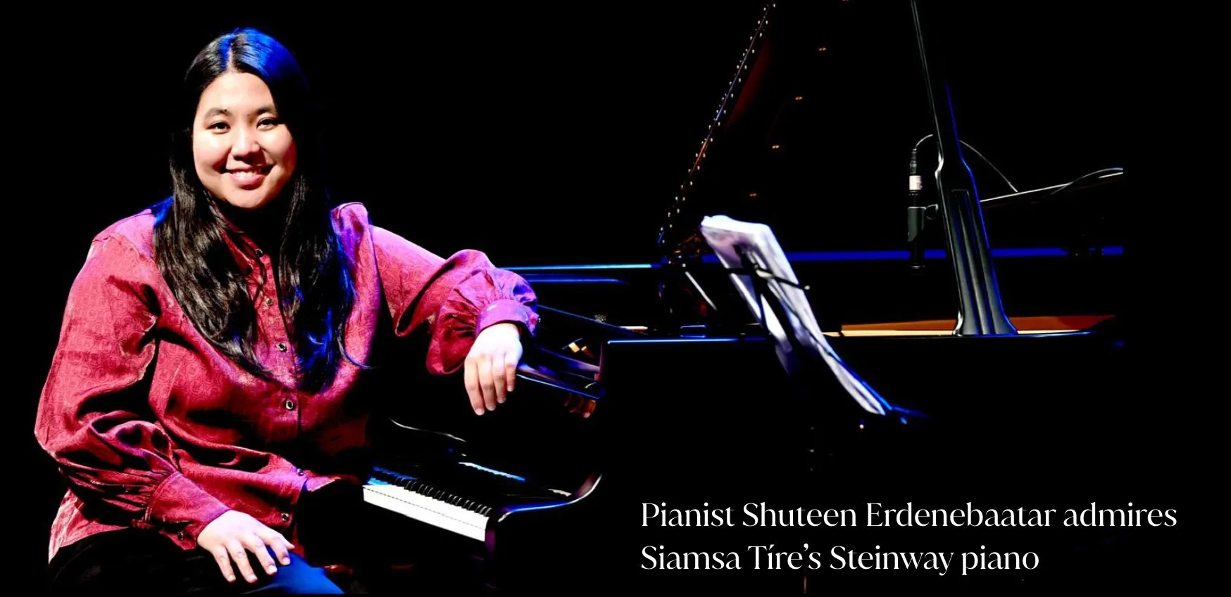 ***Photo of Mongolian pianist Shuteen Erdenebaatar sitting at a black Steinway Piano