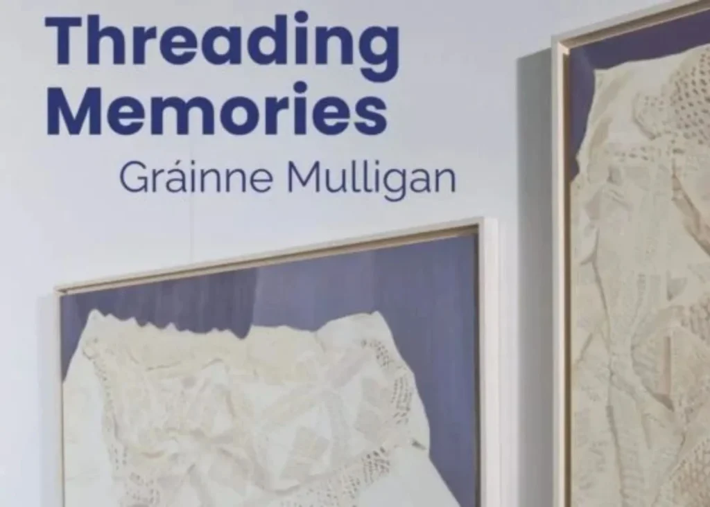 ***Photo of a piece of framed lace. Text "Threading Memories"