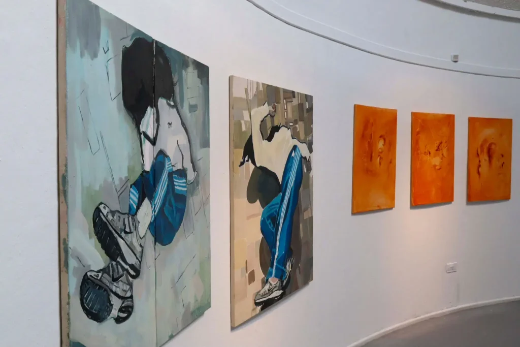 ***Photo of pieces of art on a white wall